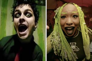 lead singer of green day yelling/singing next to a woman with dreadlocks and braids who is doing the same