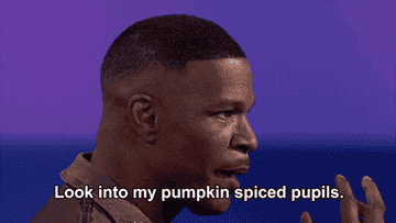 a gif of Jamie Foxx on the show &quot;Beat Shazam&quot; saying &quot;look into my pumpkin spiced pupils&quot;