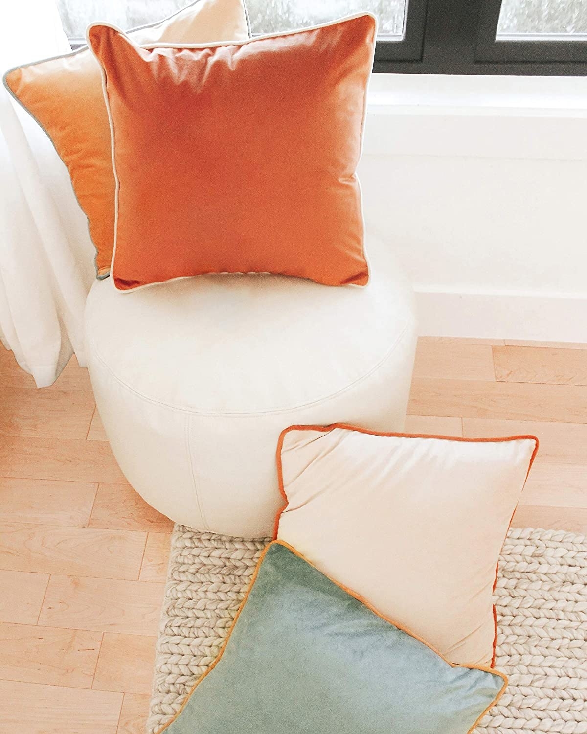 four pillows with contrasting piping color