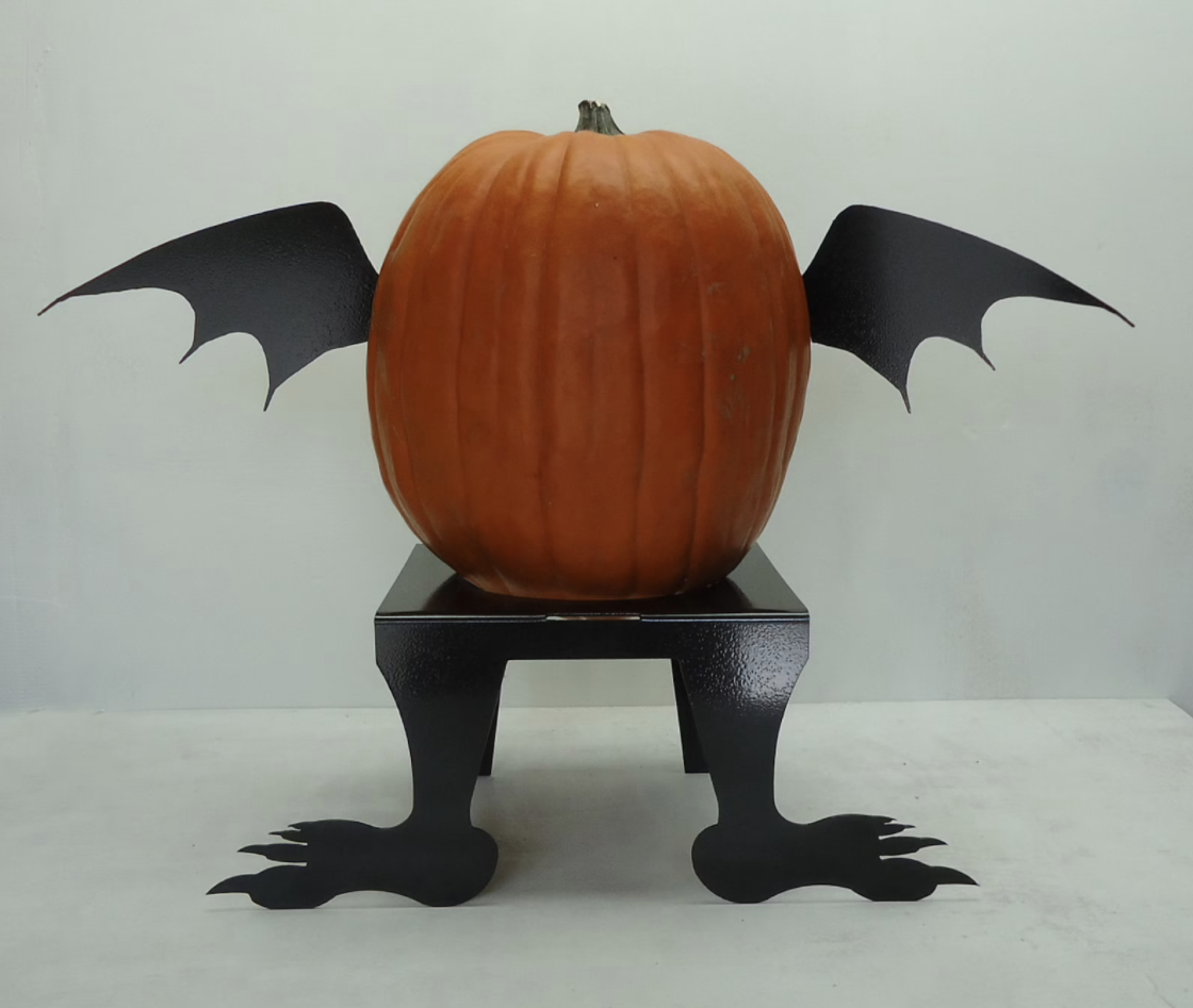 pumpkin with bat wings on it