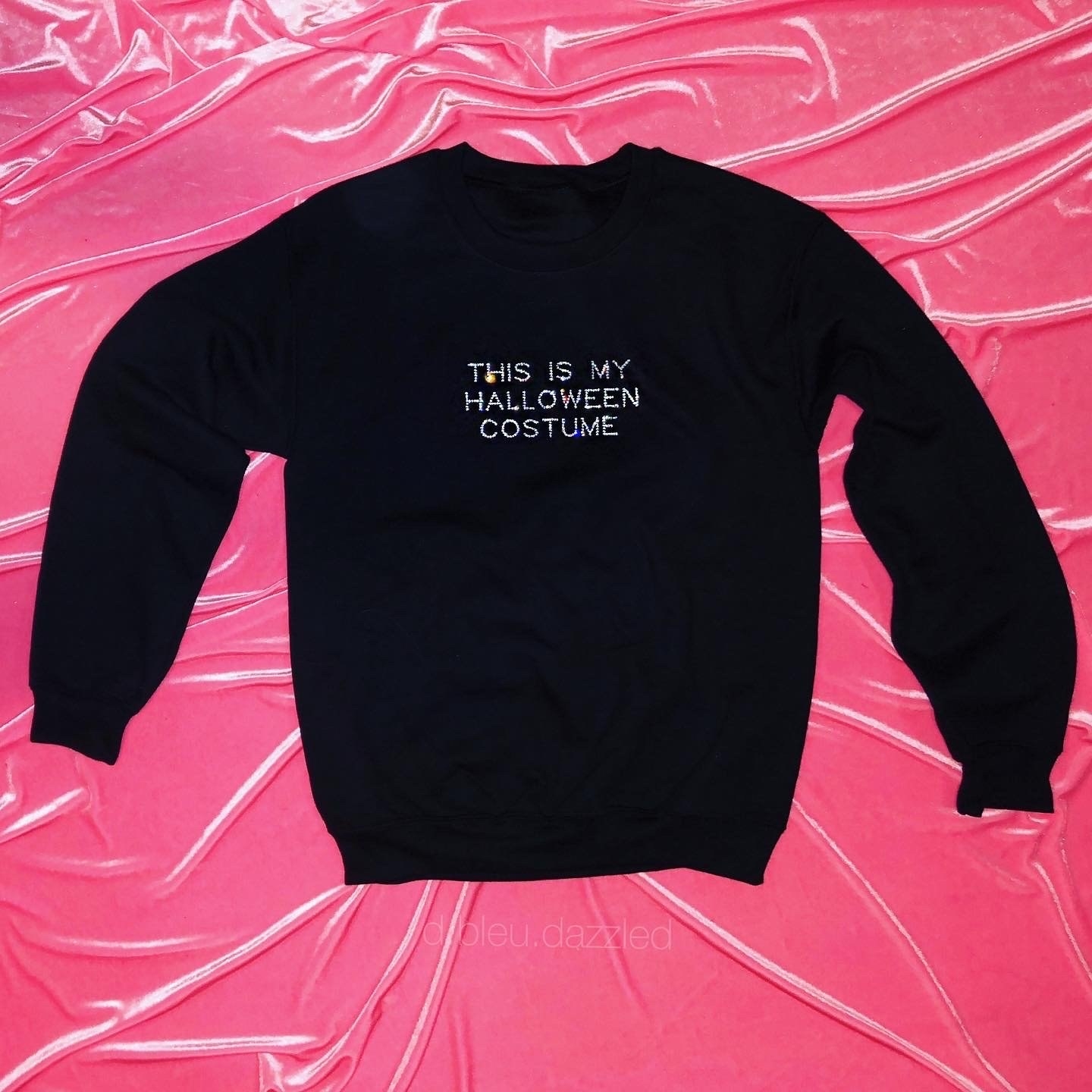 black sweatshirt with the words &quot;this is my Halloween costume&quot; spelled out in rhinestones