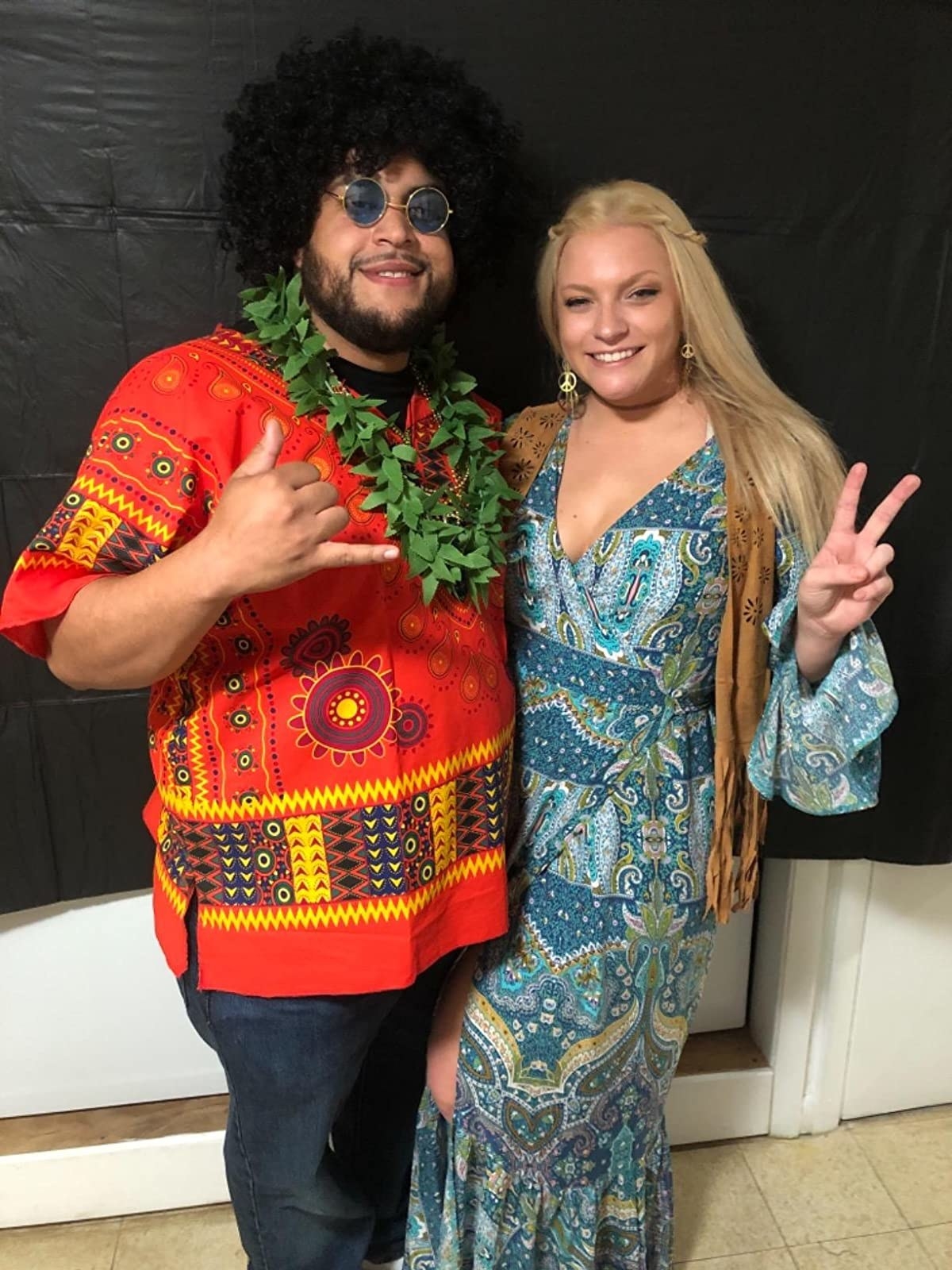 reviewer wearing the blue paisley dress for a hippie costume