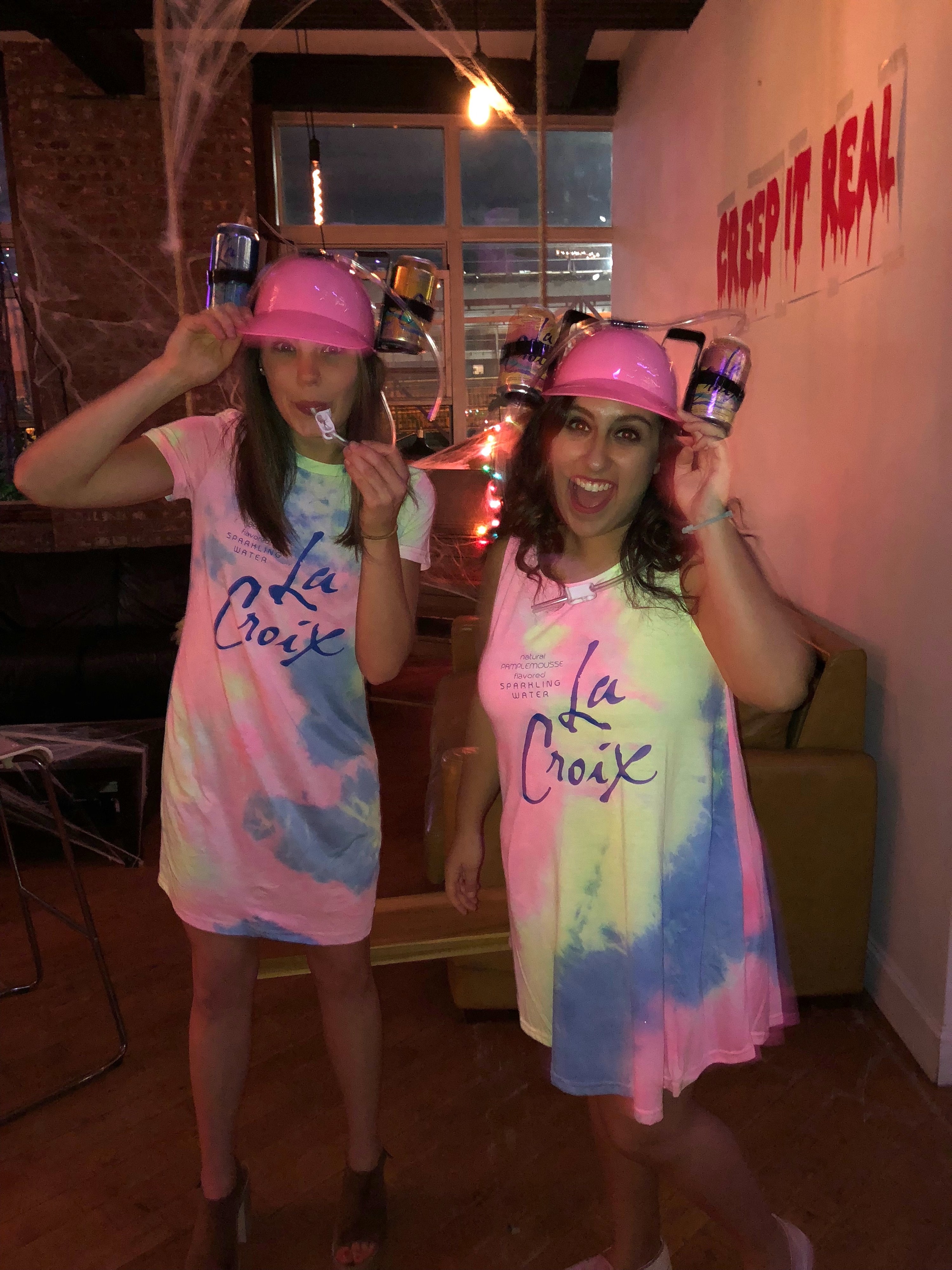 buzzfeed writer and friend wearing tie dye dresses for a la Croix can costume