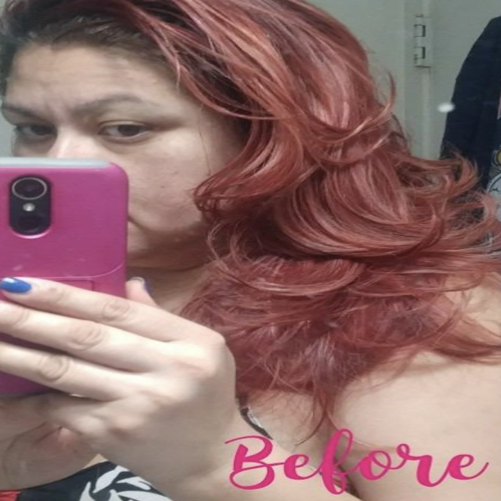 on left, reviewer with faded red/pink wavy hair