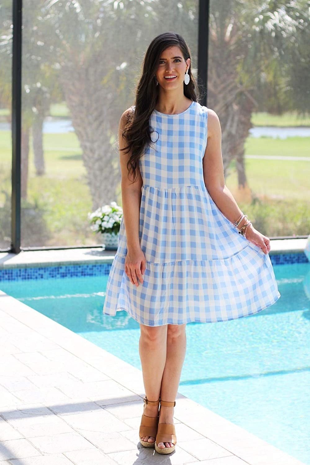 model wearing a blue gingham dress