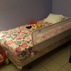 Reviewer's photo of the rail installed on their child's bed