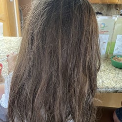 Reviewer's before photo of their child with knotted hair