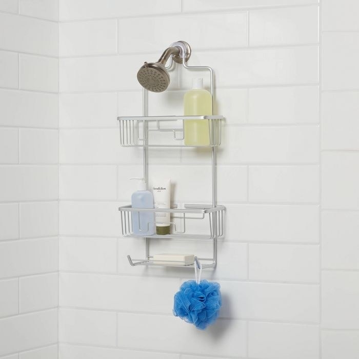 metal shower caddy hanging on shower head