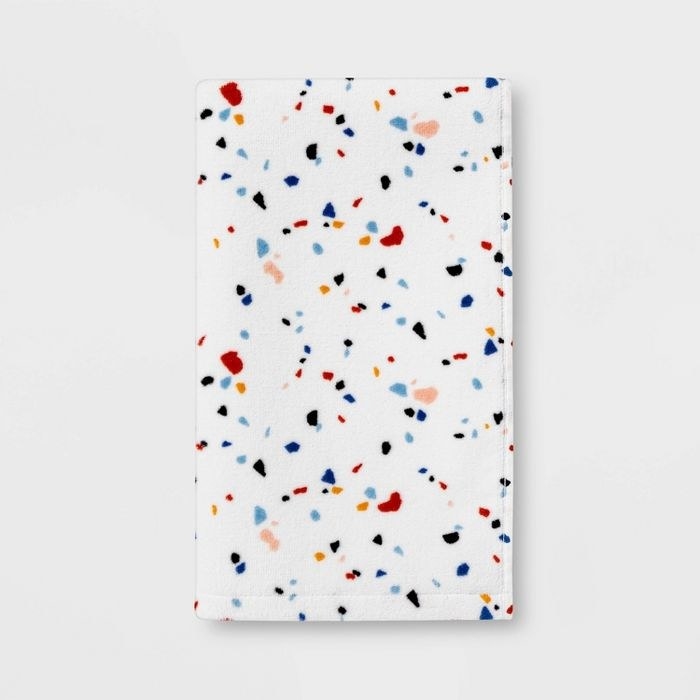 white hand towel with colorful specks
