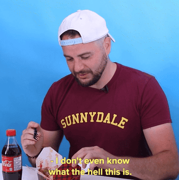 GIF of man looking at box of poutine text reads i don&#x27;t even know what the hell this is