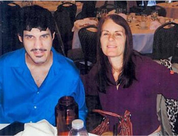 Dominic Pantoni seated at a table with his mother, Nancy Pantoni