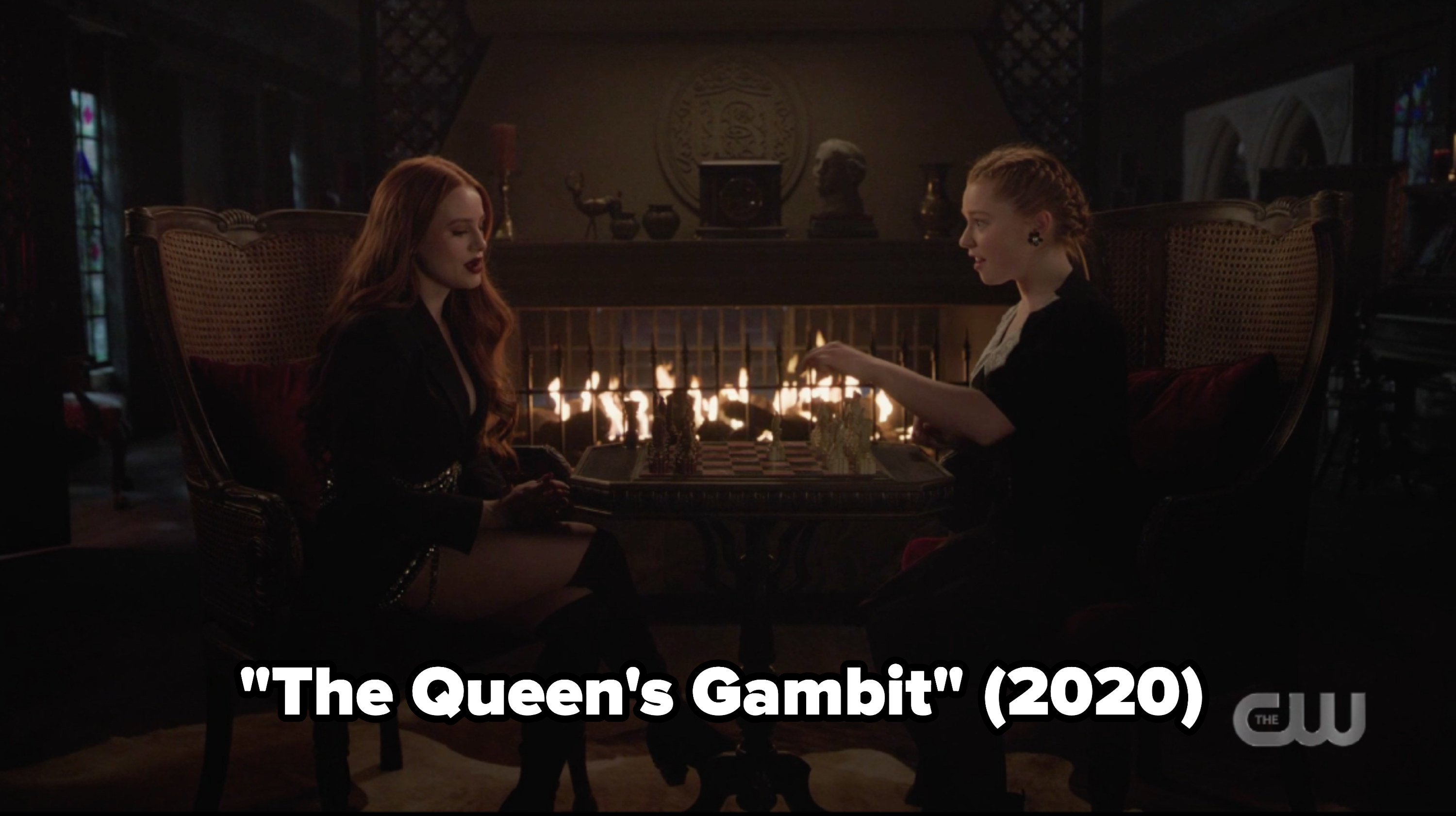Cheryl and Britta playing chess with &quot;The Queen&#x27;s Gambit&quot; as a caption
