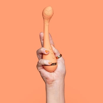 Model holding orange vibrator