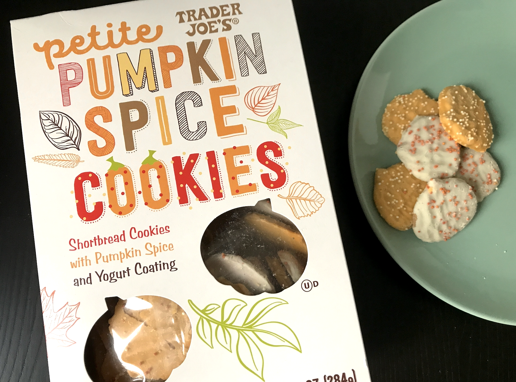 The petite pumpkin spice cookies box and a plate with cookies on it