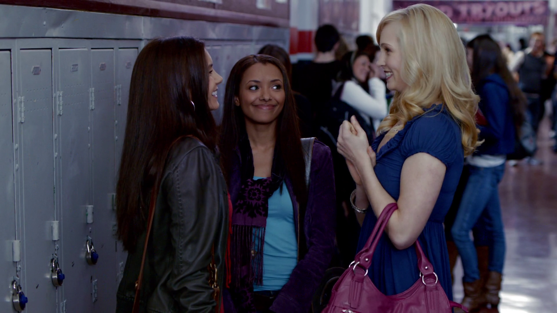 Elena, Bonnie, and Carolina gossiping outside their lockers