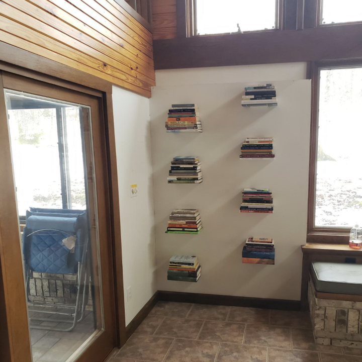 A customer review photo of the bookshelves installed on their walls