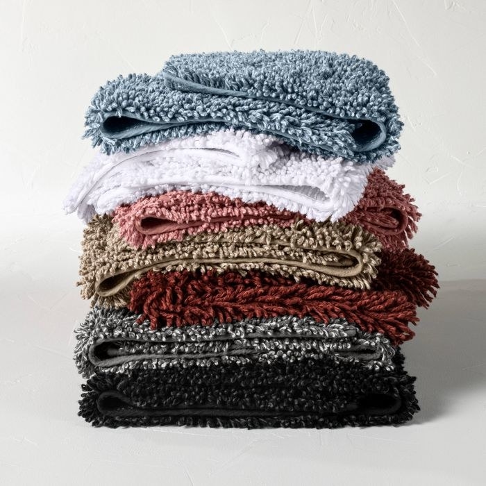 stack of colorful bath rugs