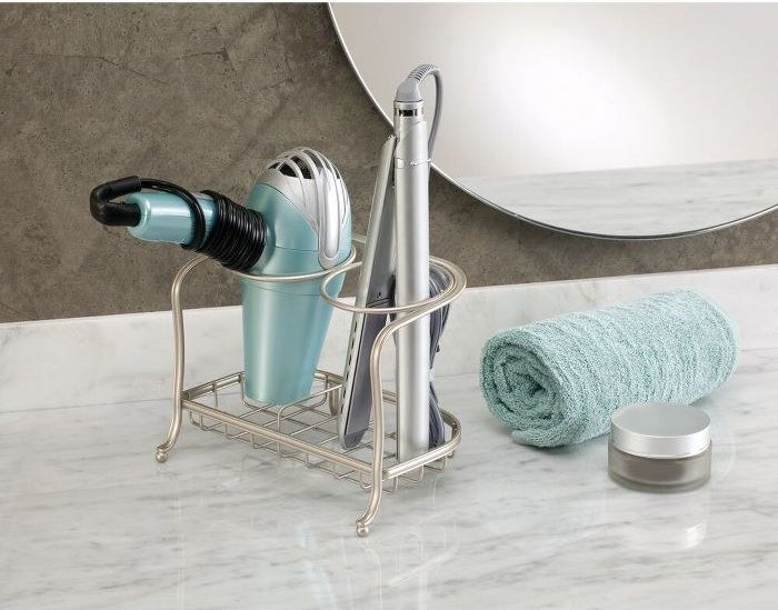hair dryer and flat iron in metal holder
