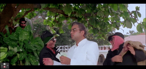 GIF showing Robert and Bhalla hitting the heads of the other kidnappers and stealing the unconscious Ram Gopal from them