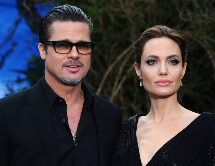 Brad and Angelina posing for photographers