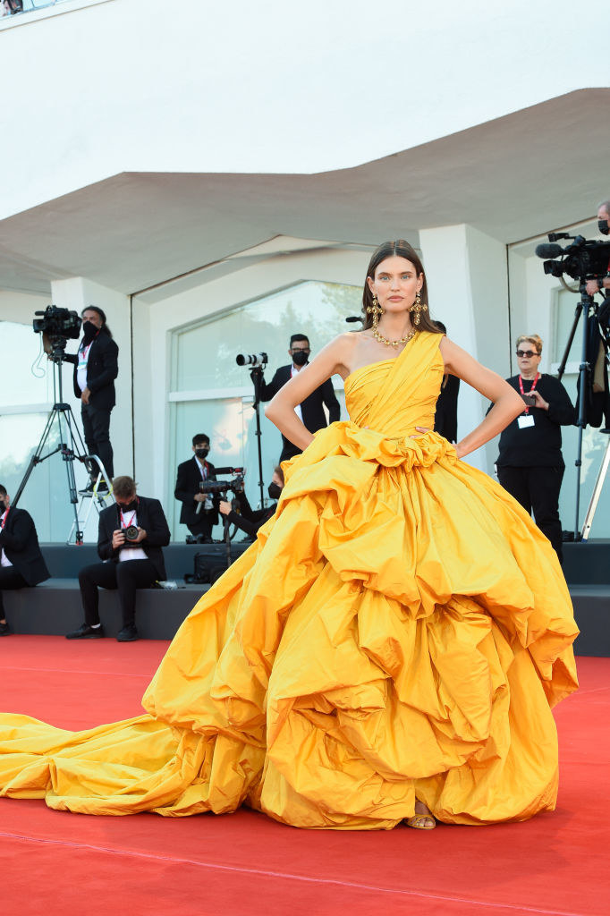 Bianca Balti in a flowing, bunched bright yellow gown on the red carpet for &quot;Madres Paralelas&quot;