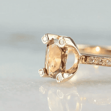 gif of the imperfect diamond ring spinning to show the impressive sparkling