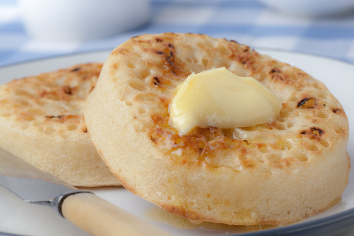 Crumpets with a pad of melting butter on top