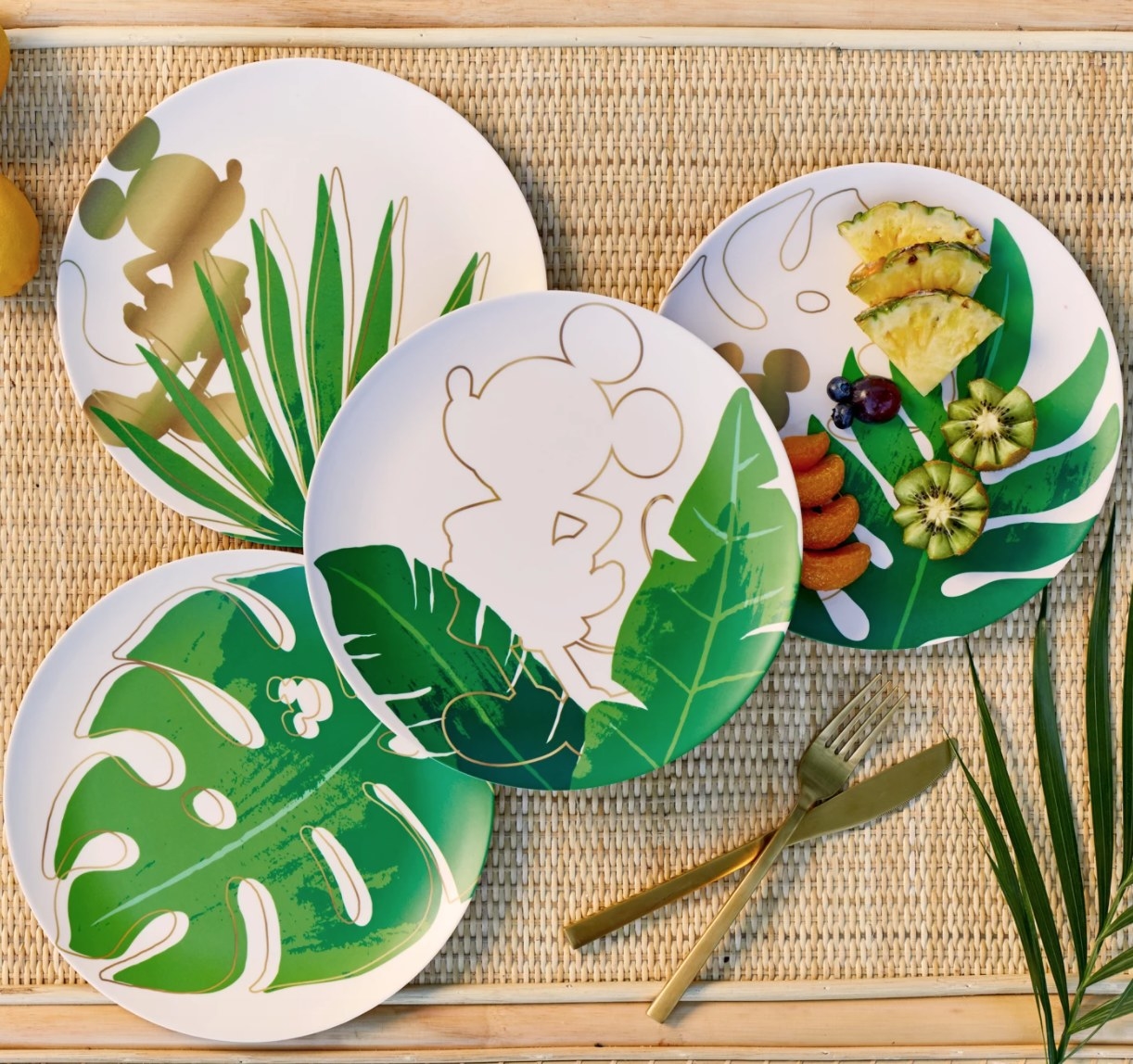 Set of four melamine plates with Mickey icons and tropical leaf print