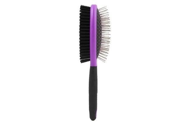 A purple brush with spiky side and bristle side