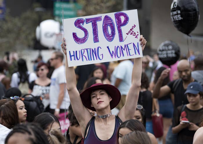 Participant with a sign reading, &quot;Stop hurting women,&quot; in the 3rd Annual Amber Rose SlutWalk in Los Angeles