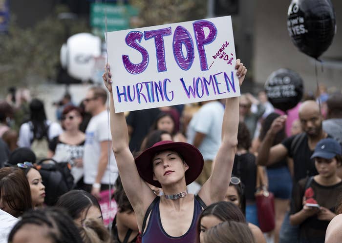 Participant with a sign reading, "Stop hurting women," in the 3rd Annual Amber Rose SlutWalk in Los Angeles