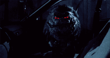Red-eyed critter flashes fangs