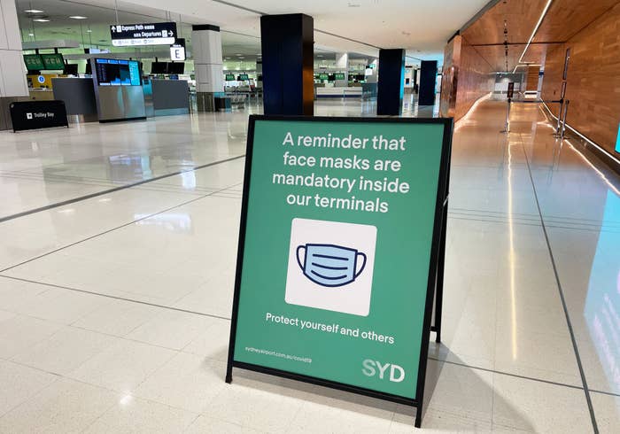 A sign at Sydney airport saying &quot;A reminder that face masks are mandatory inside our terminals&quot;