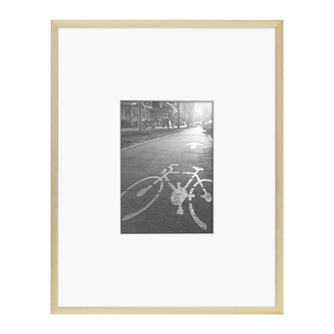 thin matted gold photo frame with black and white photo inside