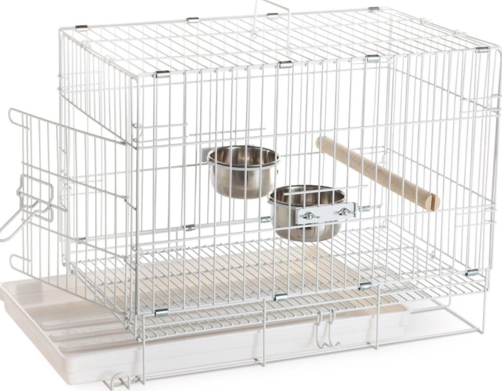an empty travel bird cage