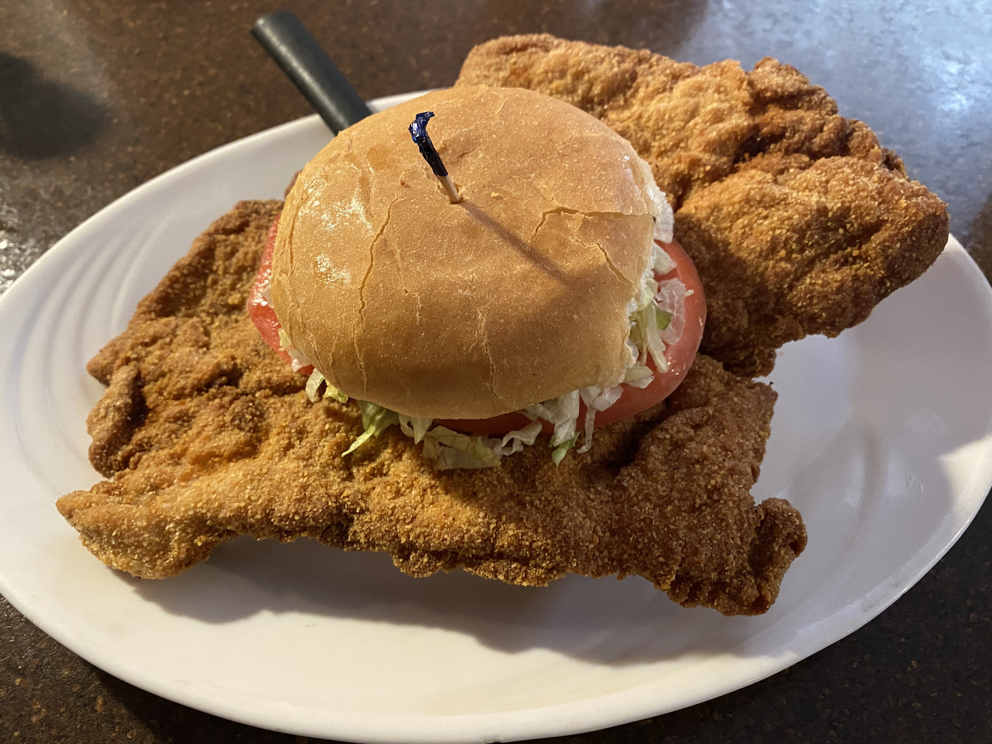 A giant pork tenderloin sandwich.