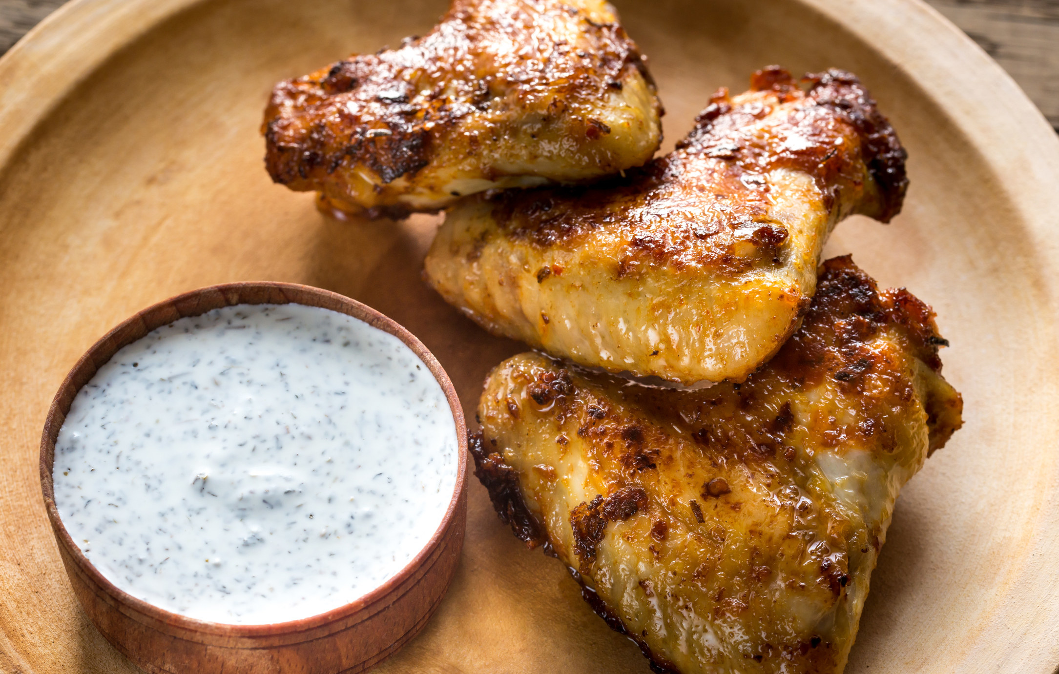 Fried chicken wings with Alabama white sauce.