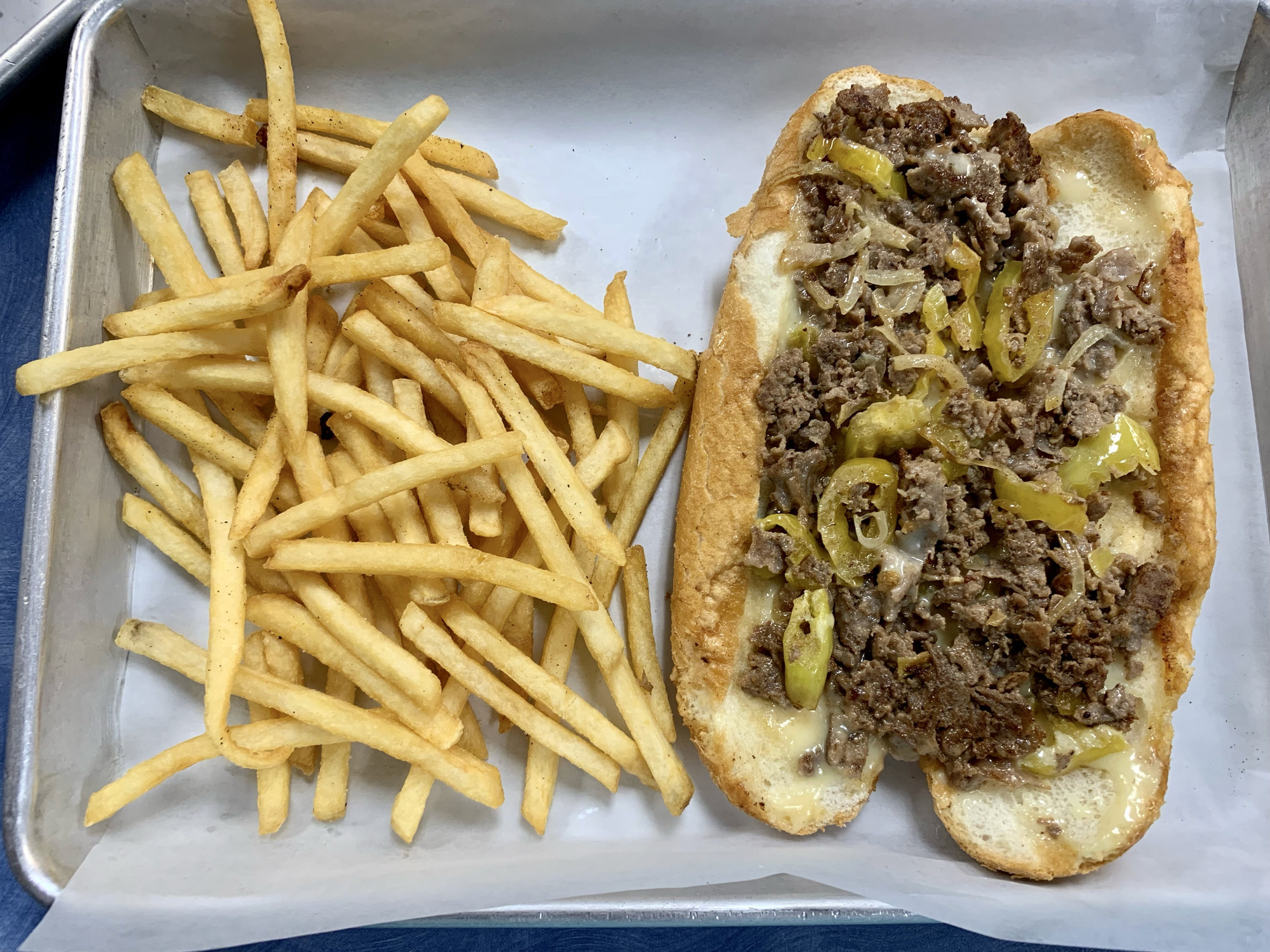 Philly cheesesteak and fries.