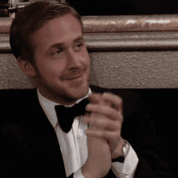 Gosling clapping at the Golden Globe awards