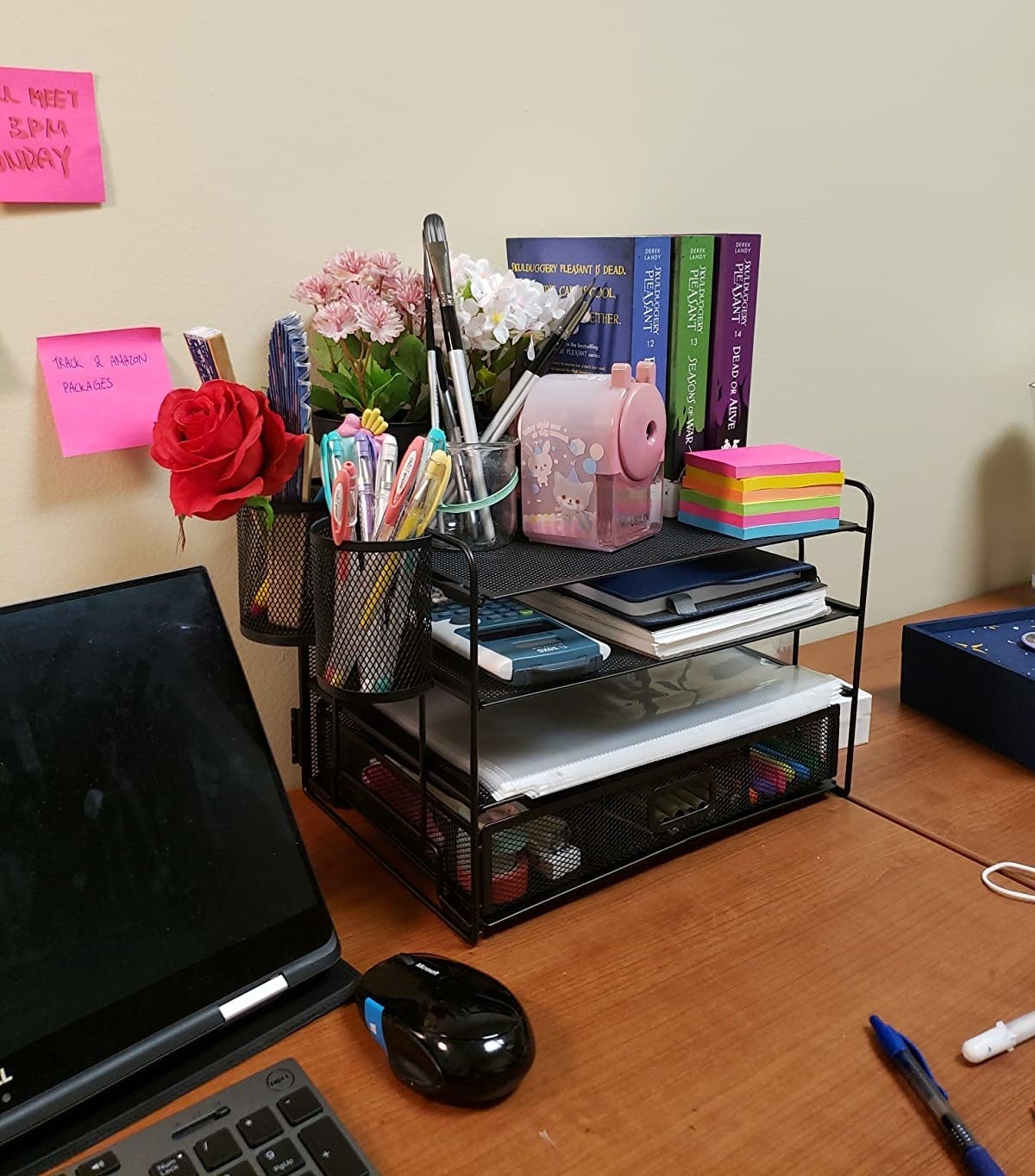reviewer image of the 4-tray mesh organizer on their desk