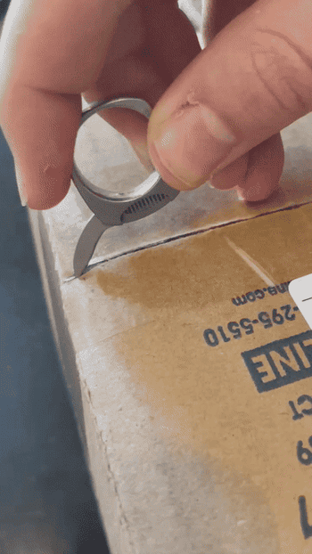 gif of my husband using the knife on his ring to open a package 