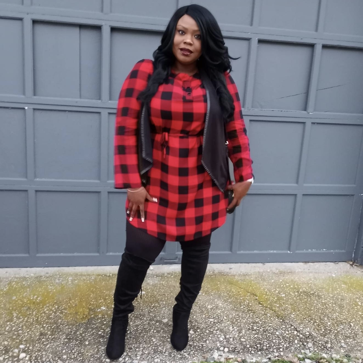 reviewer wearing plaid dress with otk boots 