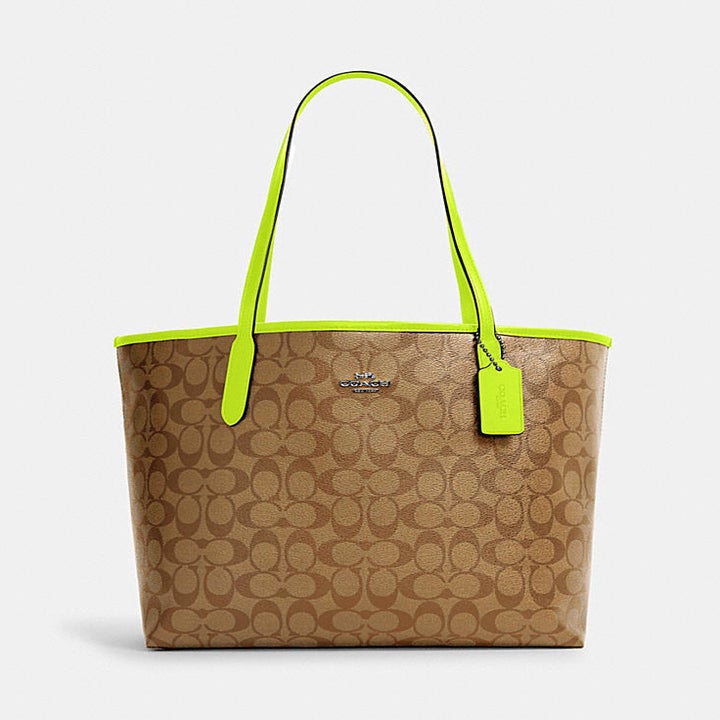 a large tote with a design featuring the coach logo