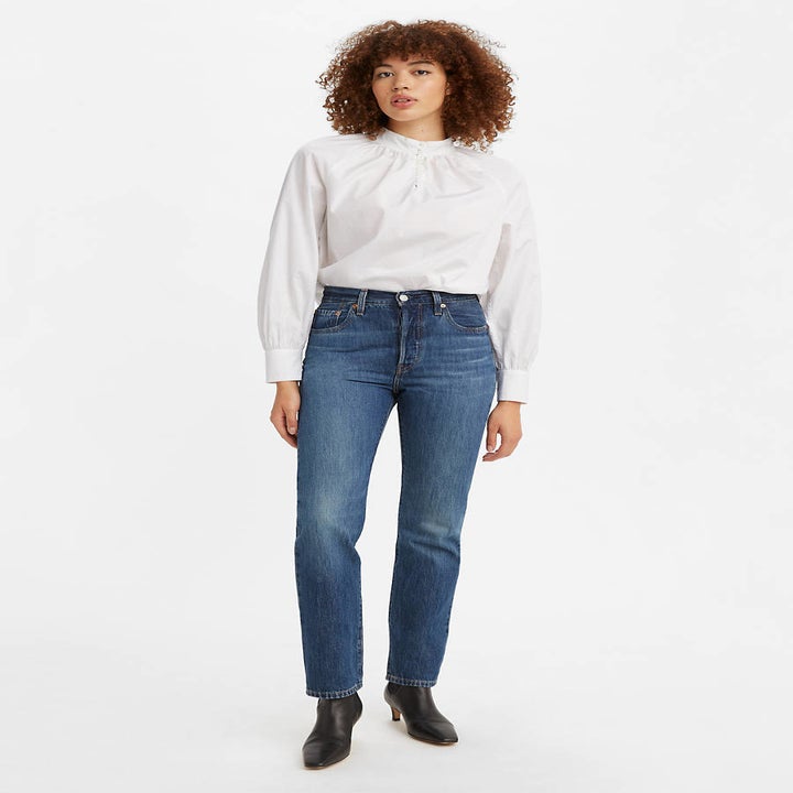 a model in 501 medium wash straight jeans