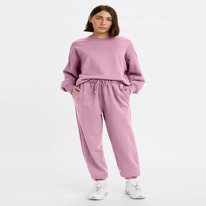 a model in purple sweatpants