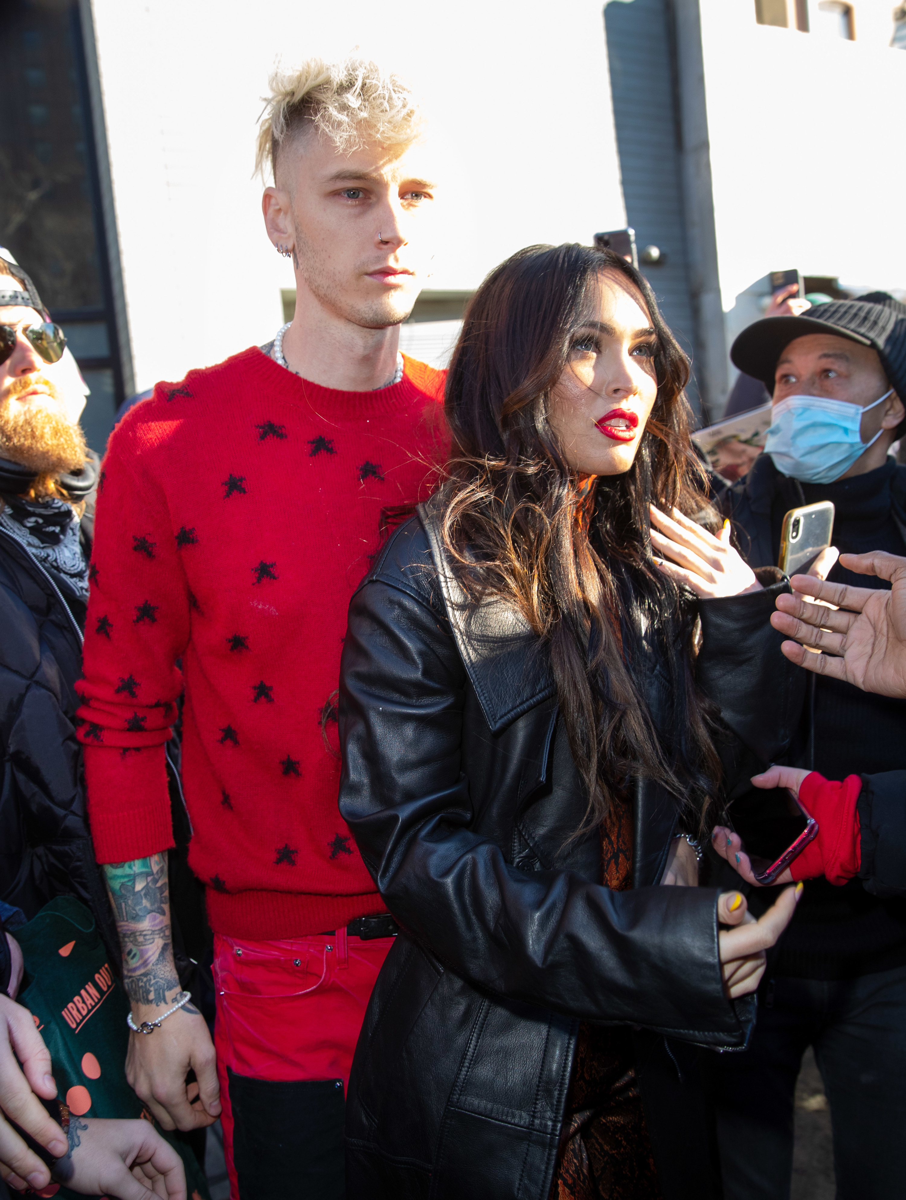 The couple walking through a crowd