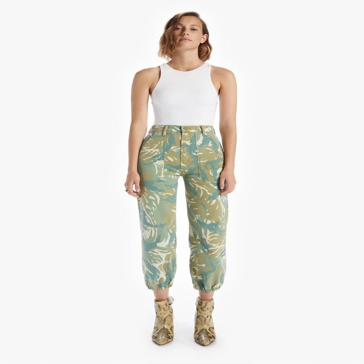model in blue and green printed ankle pants