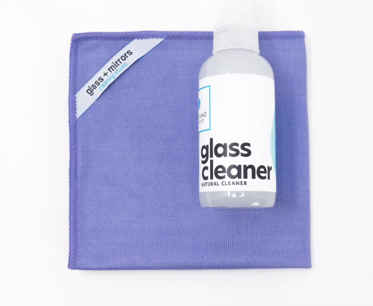 the glass cleaning kit with clear bottle and purple microfiber cloth