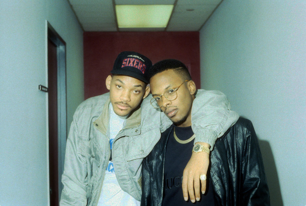 Wearing a cap with his arm around around DJ Jazzy Jeff&#x27;s shoulder in 1989
