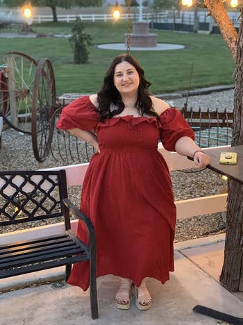 reviewer wearing red midi dress 